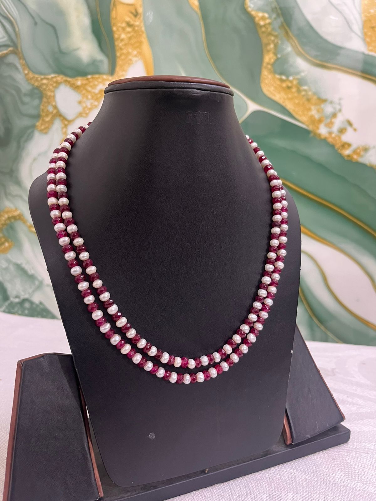Shop elegant double-layer necklace featuring lustrous pearls and pink gemstone beads. Perfect for weddings, parties, gifting, and luxury fashion wear.